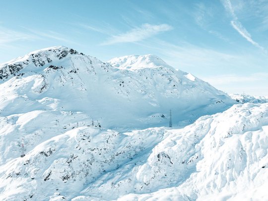 Hotel Maiensee: your hotel in St. Christoph Snow-covered mountains under a clear blue sky