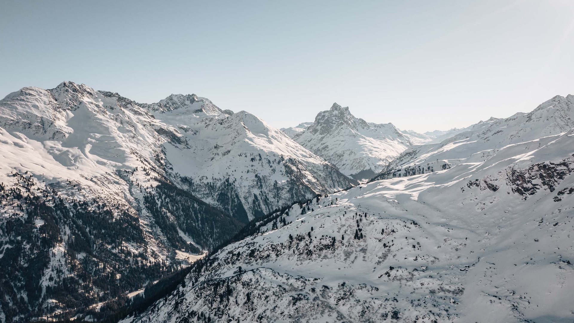 Hotel Maiensee: your hotel in St. Christoph Snow-covered mountains under clear sky on a sunny winter day