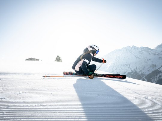 Your hotel in St. Christoph am Arlberg Person skiing on snowy slope with mountain scenery in the background