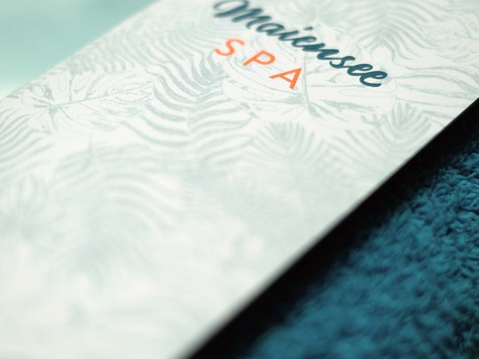 Hotel Maiensee: wellness near St. Anton am Arlberg Omaiersee Spa card on a blue towel