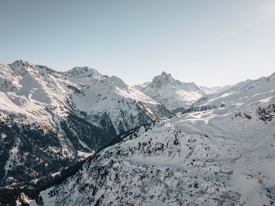 Hotel Maiensee: your hotel in St. Christoph Snow-covered Alpine mountains under clear sky